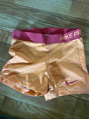 Nike Women's Peach-Orange Training Bike Shorts with Pink Waistband